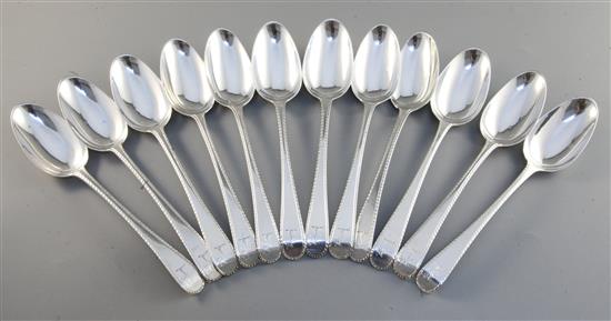 A set of twelve George III silver feather edge pattern tablespoons, engraved with the Houghton crest, 26.9oz